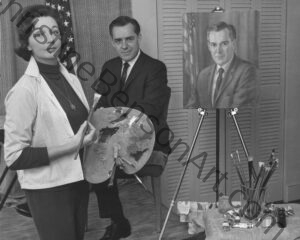 A photograph the artist Christine Benson painting a portrait of Congressman William Broomfield