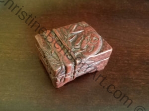 A small Carved Music Box closed