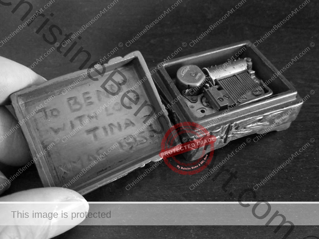 A small Carved Music Box open showing carved message: "To Benny with Love Tina - Xmas 1956"