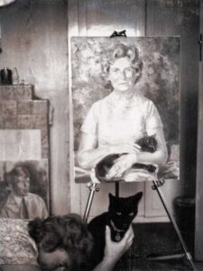 A polaroid of the Stella Fry portrait with Stella being camera shy but trying to get the cat in the picture.