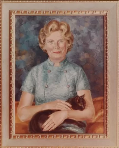 Portrait of Stella Fry with a black cat