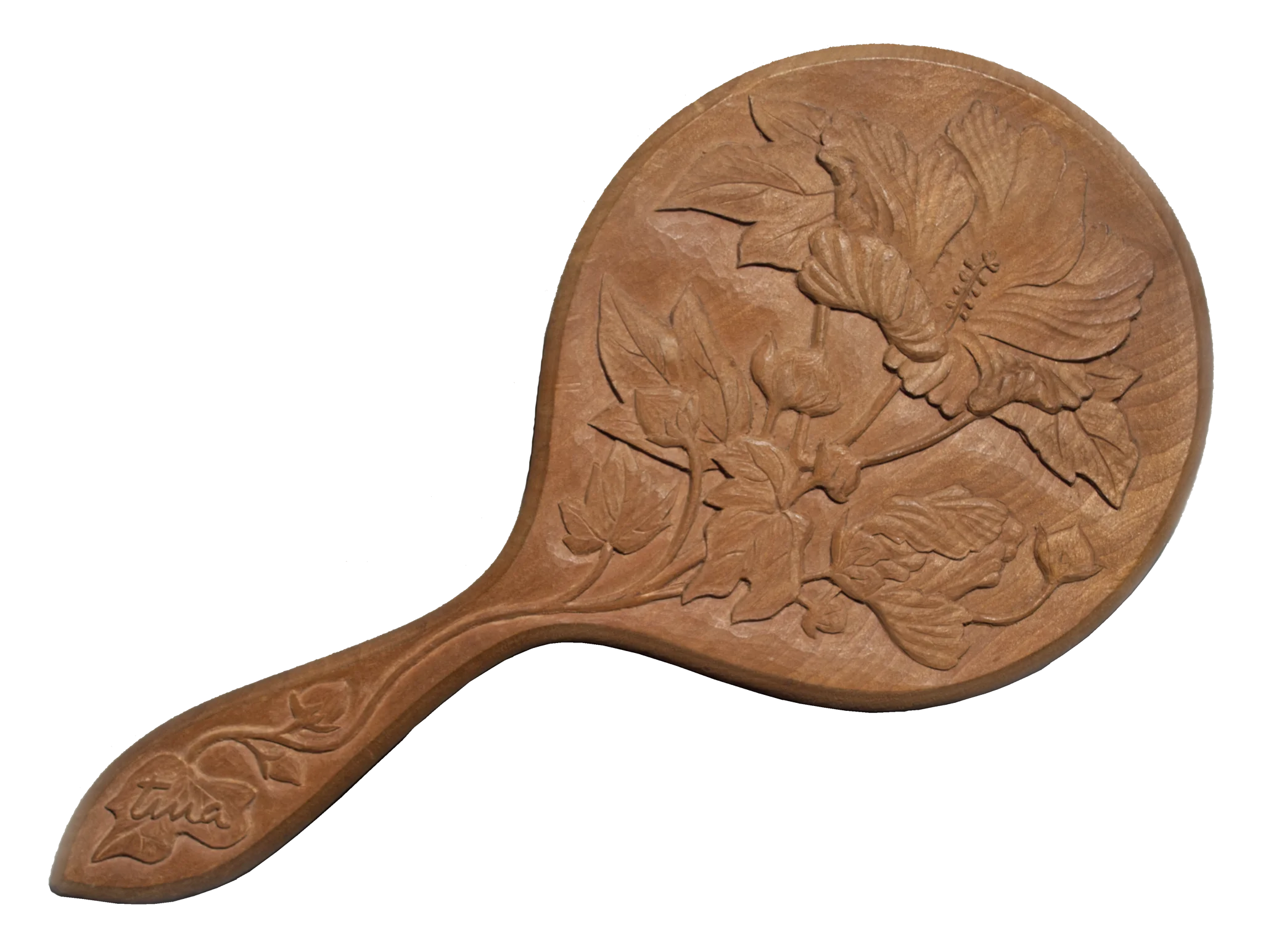 a carved wooden hand mirror