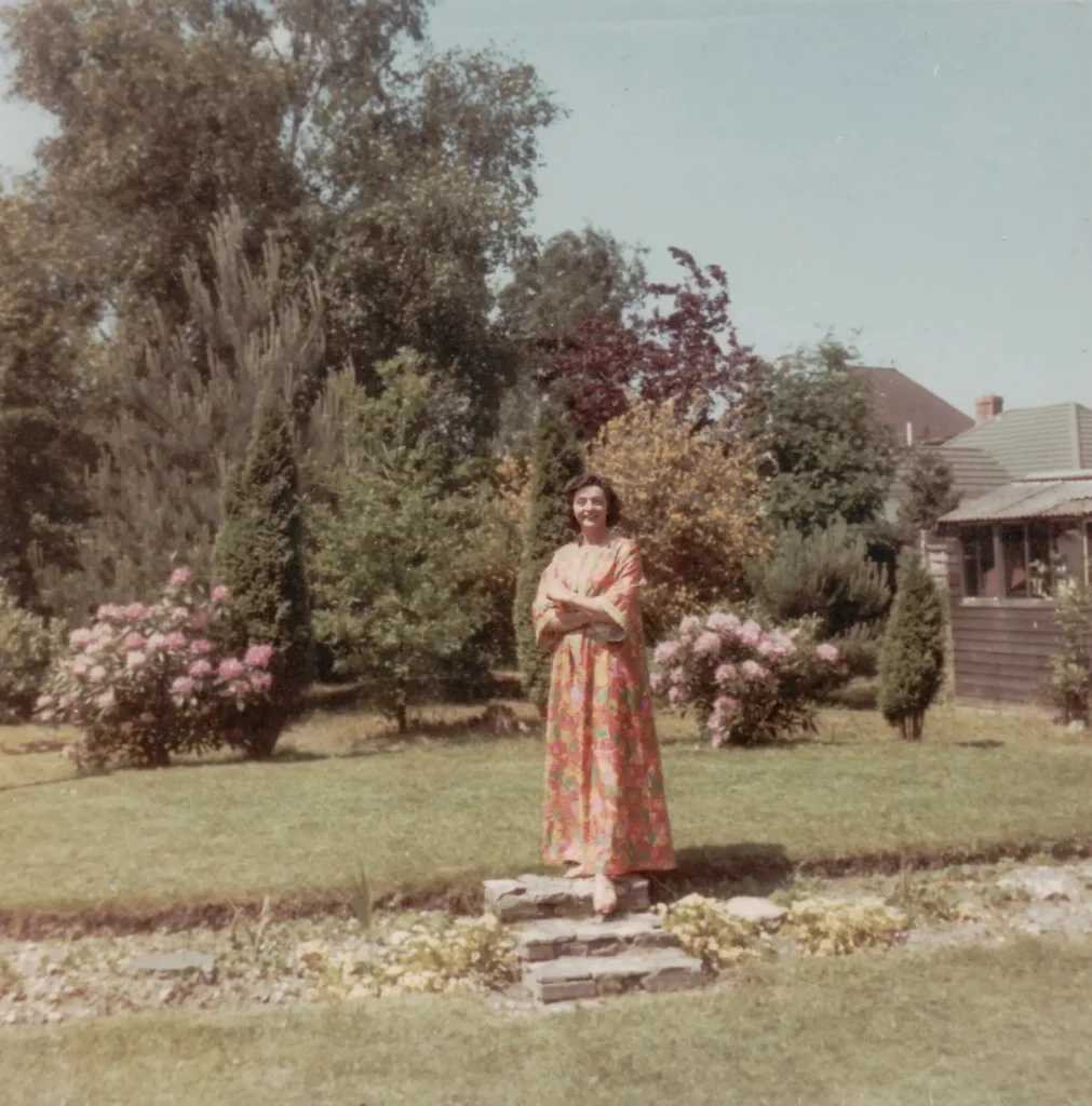 Photograph of Christine Benson in her back garden in Bournemouth in the 1060s